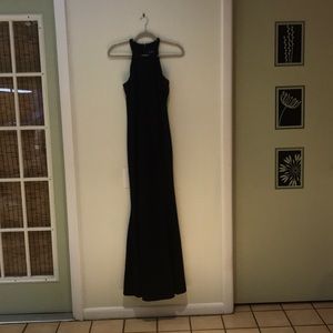 A black maxi dress with a beaded neck line.